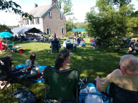 crowd on the lawn enjoying the music