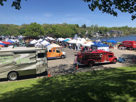 grounds for the block party with tents and firetrucks