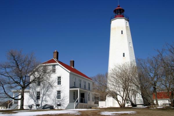 Sandy Hook Lighthouse under a blue sky